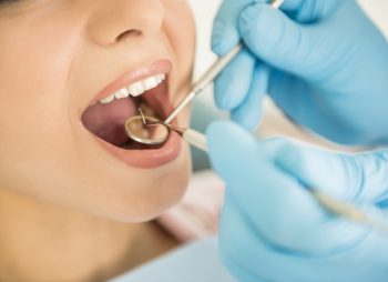 Dentist examining a patient's teeth in the dentist.